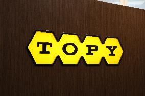 Topy Industries signage and logo
